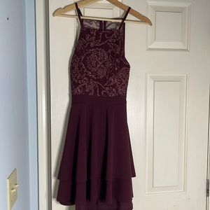 This is a beautiful burgundy dress that has a little flair and stretches well.